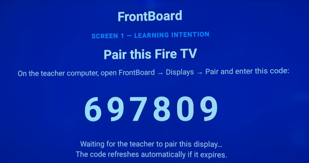 A Fire TV showing the FrontBoard pairing screen with a six-digit code